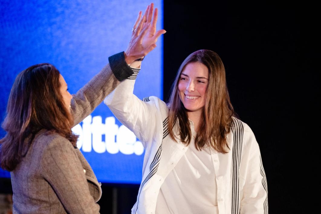 USA Women's Hockey and Seattle Torrent Hilary Knight high-fives USWNT alum and TNT sports broadcaster Julie Foudy onstage during the 2026 SheBelieves Summit. (Photo by Ali Gradischer/USSF/Getty Images)