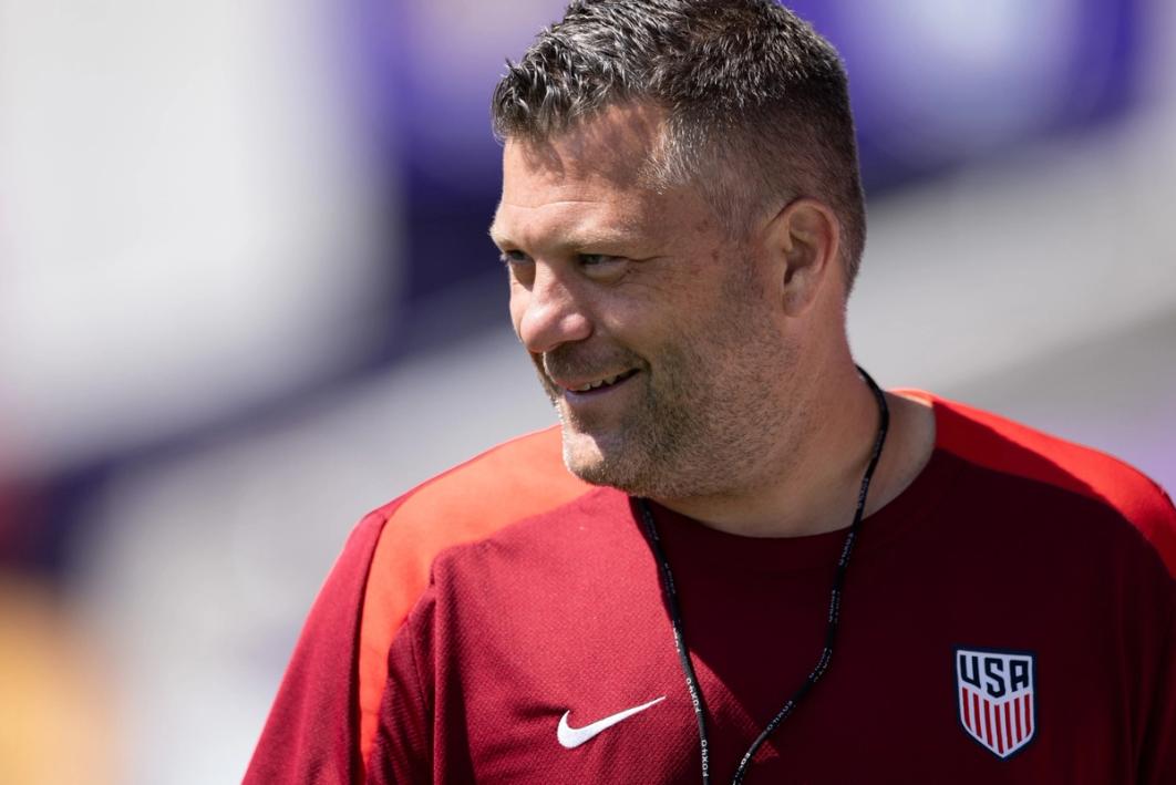 USMNT Assistant BJ Callaghan smiles and looks to the side on a close up photo