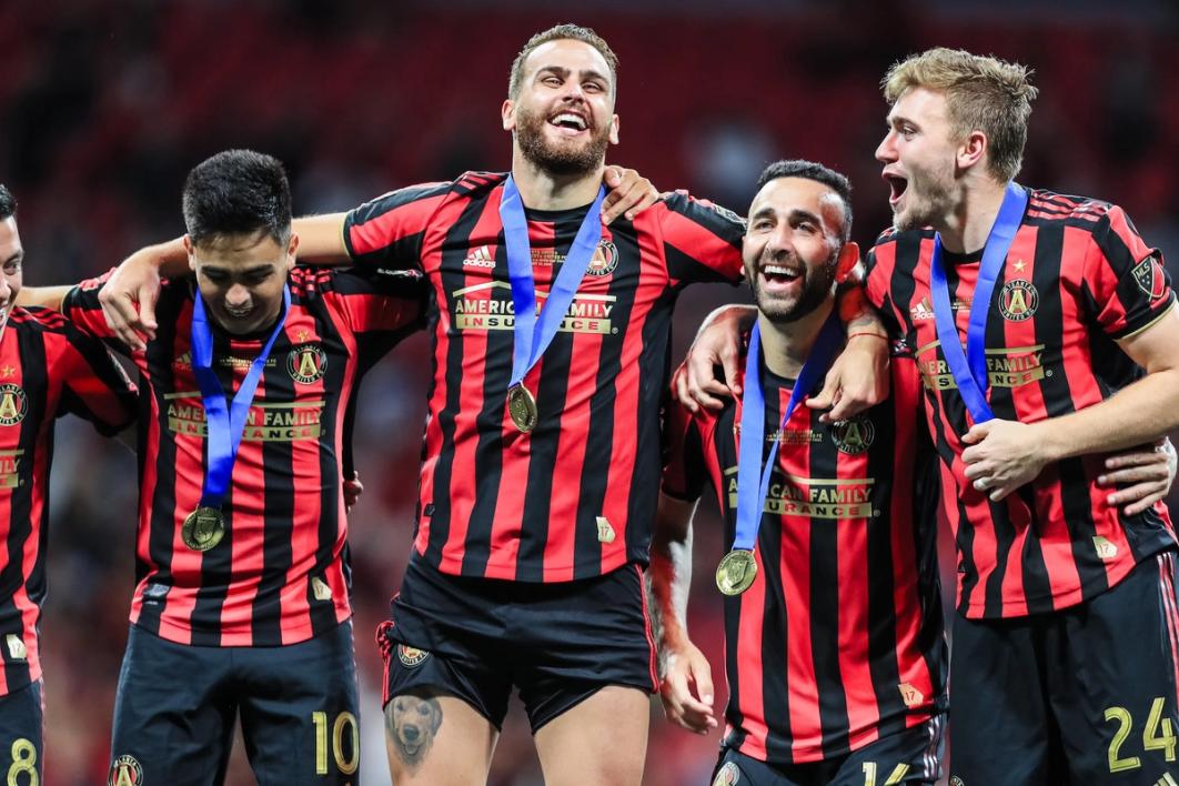 Justin Meram (2nd from R) celebrates winning the 2019 Open Cup with Atlanta United