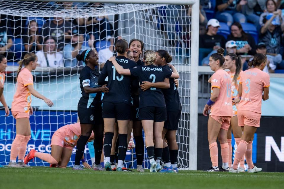 Members of NJ/NY Gotham celebrate during a match against the Orlando Pride