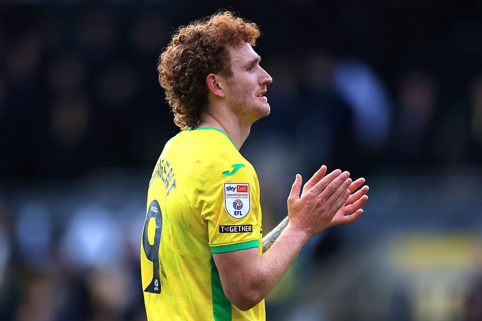 Josh Sargent clapping in yellow Norwich City shirt