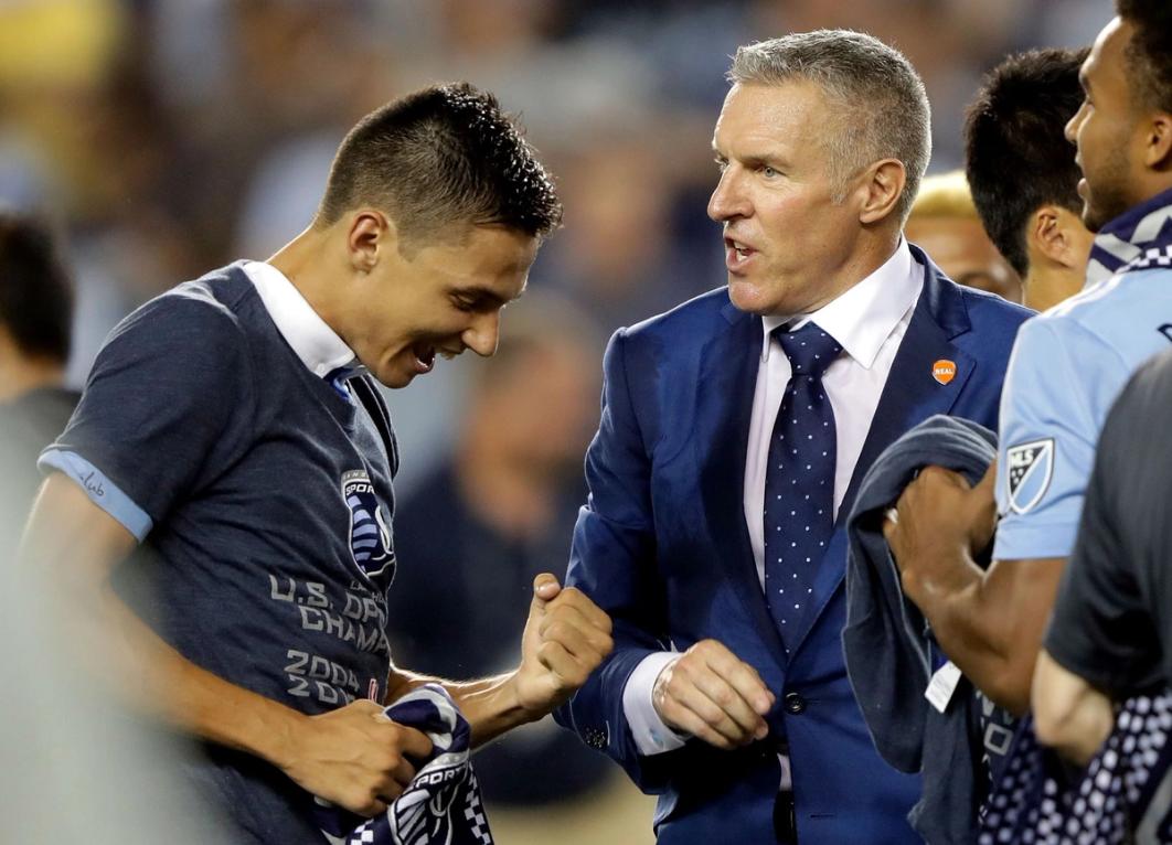 Vermes on the sidelines with a player following a US Open Cup victory