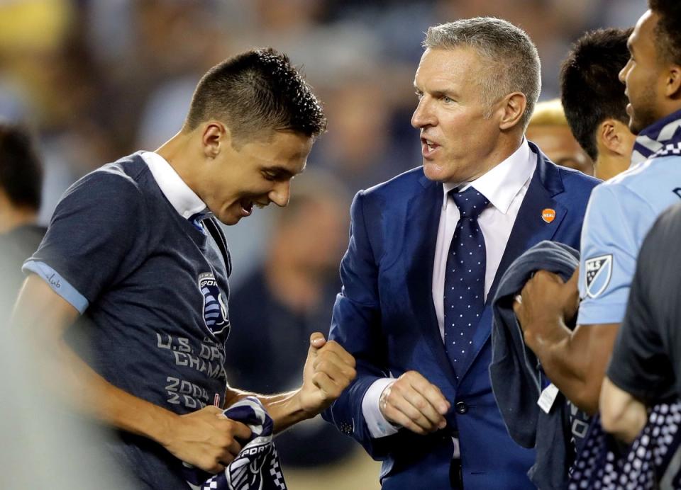 Vermes on the sidelines with a player following a US Open Cup victory