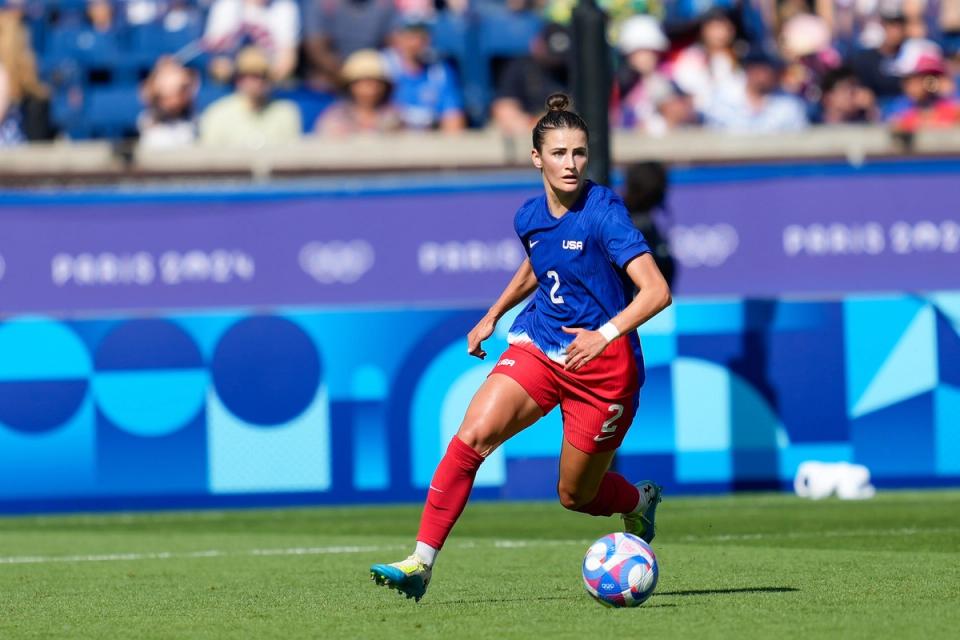 Emily Fox dribbles a ball during a match