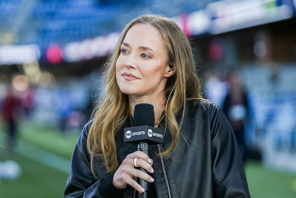 Becky Sauerbrunn holding TNT mic on the field during live show