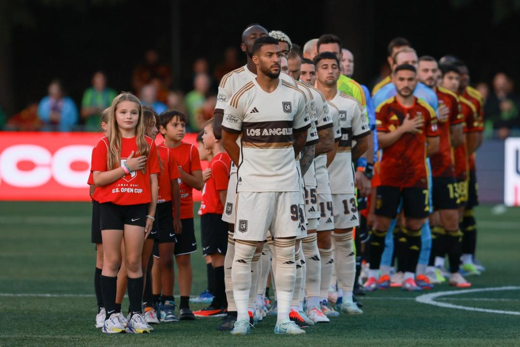 LAFC players line up for the anthem before a match