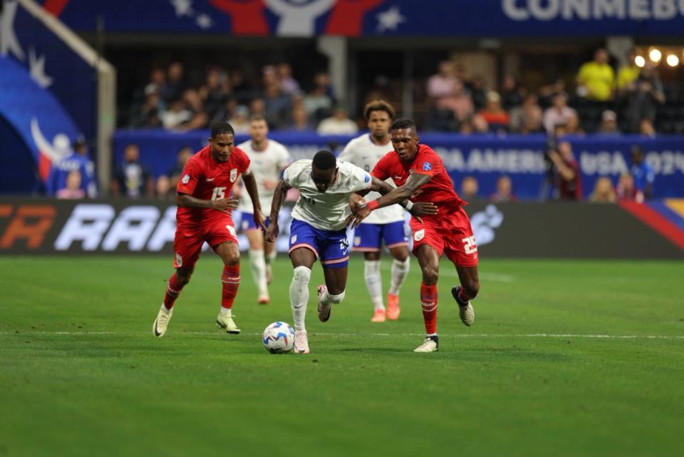 USA Forward Folarin Balogun fights for the ball against two Panamanian players during the USA's Copa America match against Panama
