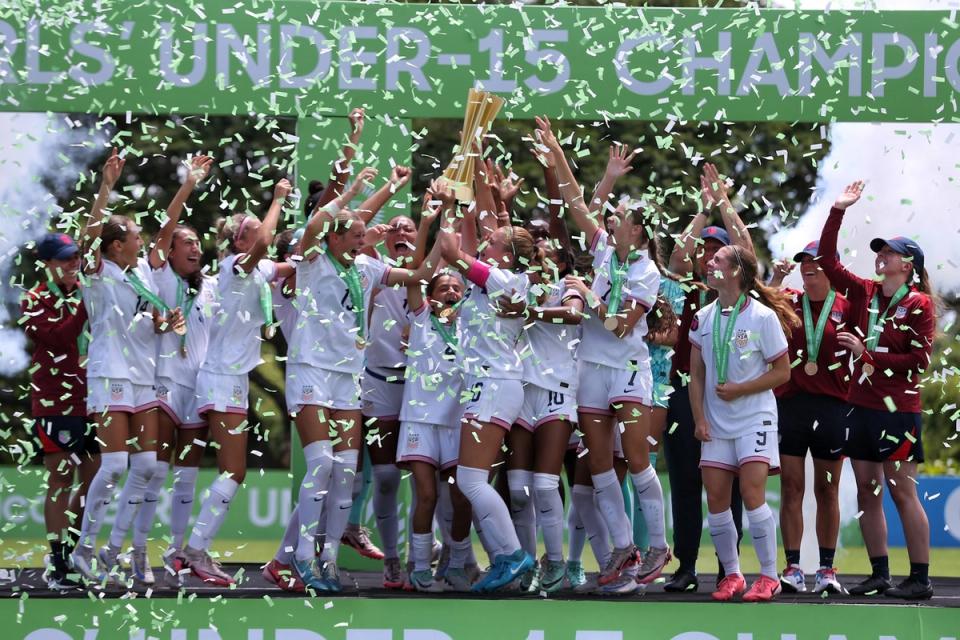 The US U15 WYNT celebrates winning their trophy