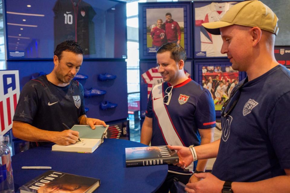 Former United States player Landon Donovan signs autographs for fans while doing a book signing prior to an international friendly between the United States and Belgium at Mercedes-Benz Stadium on March 28, 2026 in Atlanta, Georgia. (Photo by Johnnie Izquierdo/USSF/Getty Images)