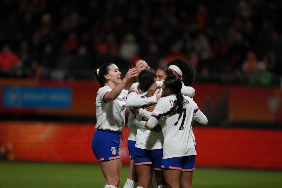 Members of the USWNT celebrate after a goal against the Netherlands