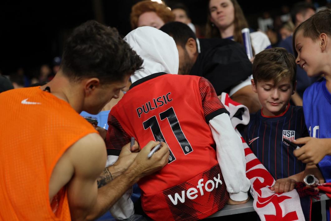Christian Pulisic of the United States signs autographs after playing Japan at Lower.com Field (Photo by John Dorton/ISI Photos/USSF/Getty Images)