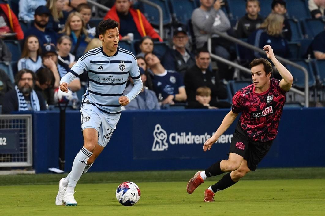 Salloi dribbles the ball during a match