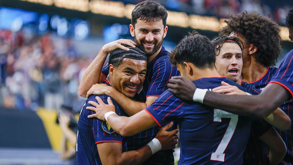 USMNT celebrates around Malik Tillman after goal