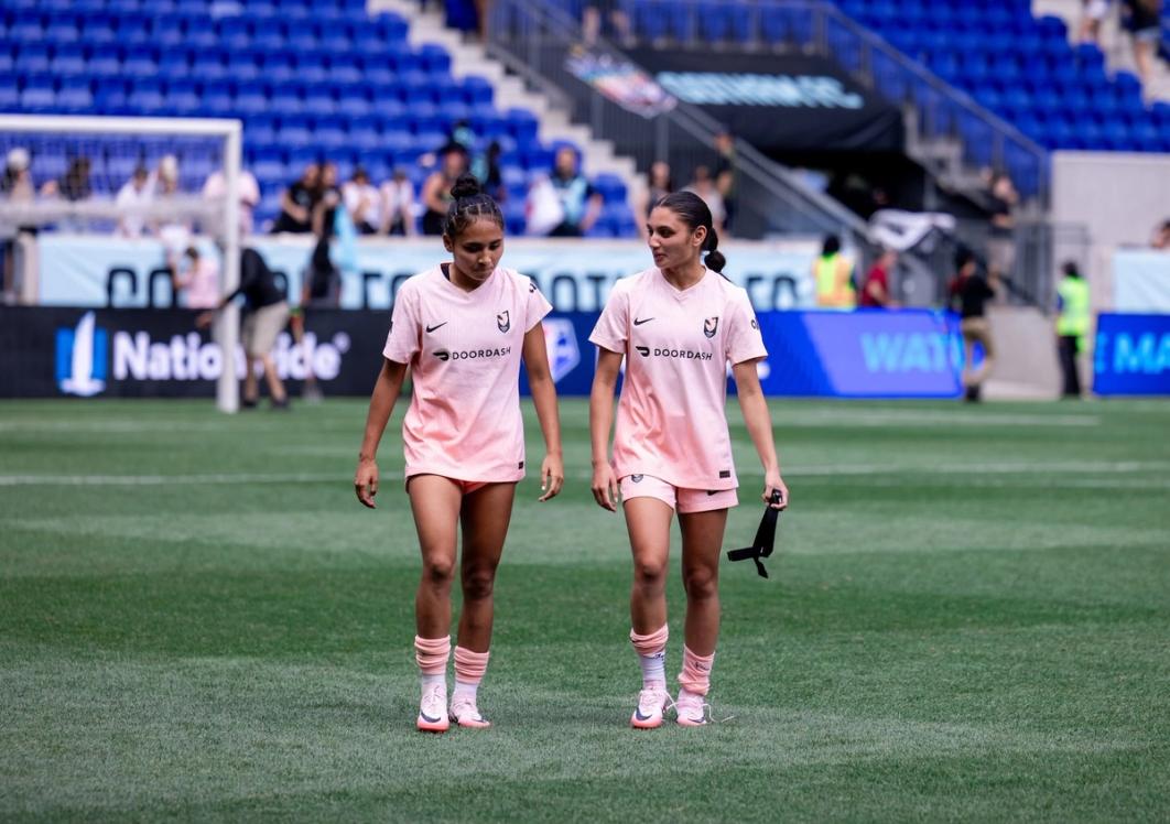 Alyssa and Gisele Thompson on the field for Angel City FC