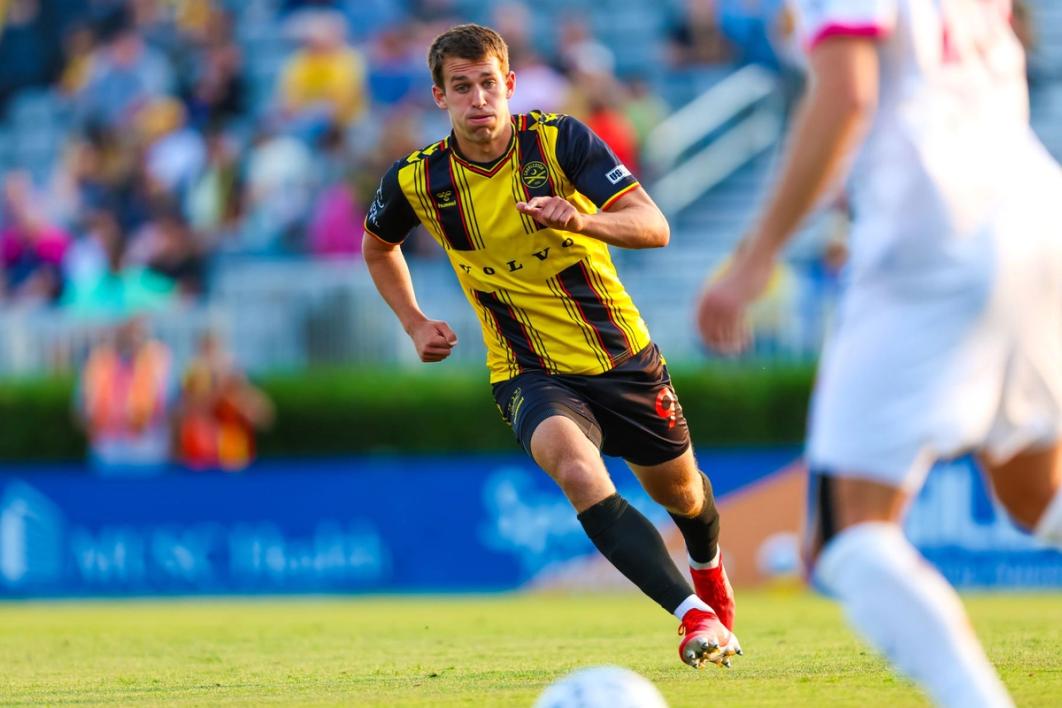 Charleston Battery player MD Myers runs towards a ball during a match