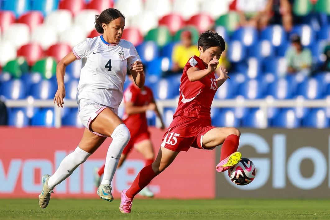 U.S. player Jordyn Bugg chases down a Korea DPR player who is dribbling the ball