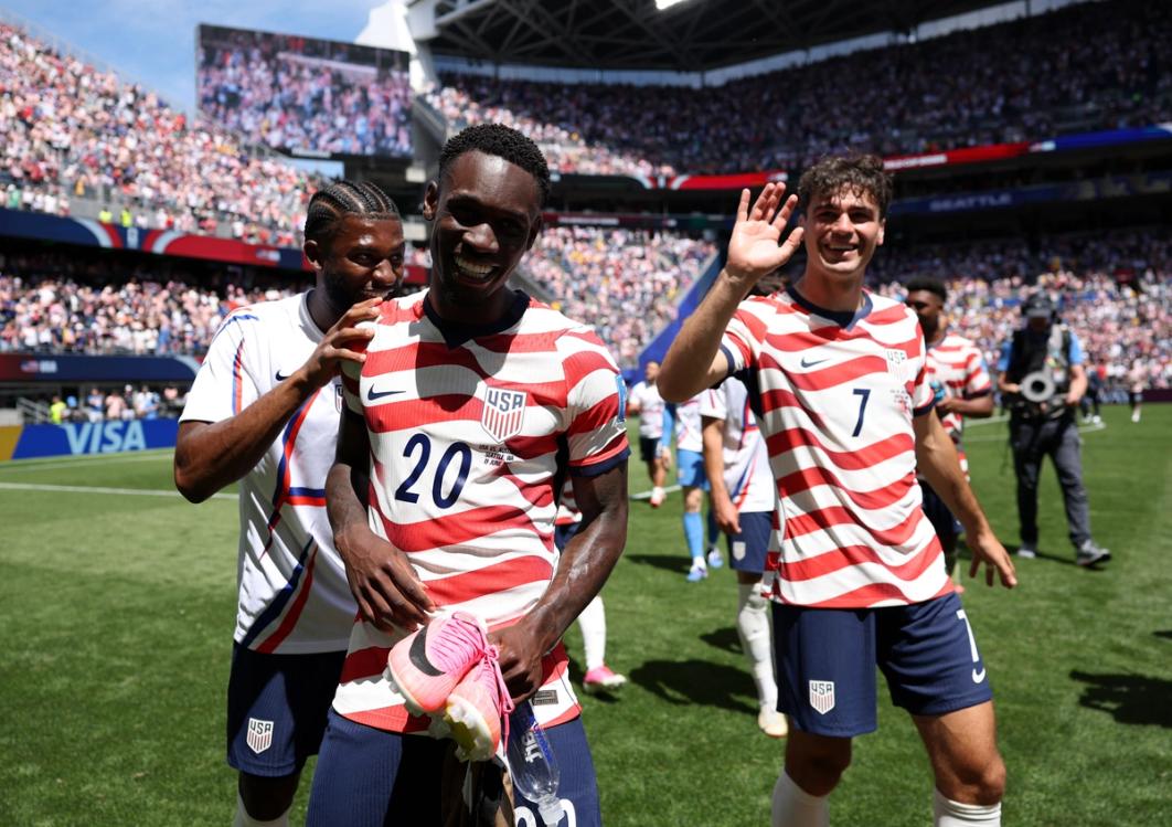 Folarin Balogun (center) with teammates Mark McKenzie (left) and Gio Reyna (right) after the USMNT's 2-0 win over Australia in Seattle