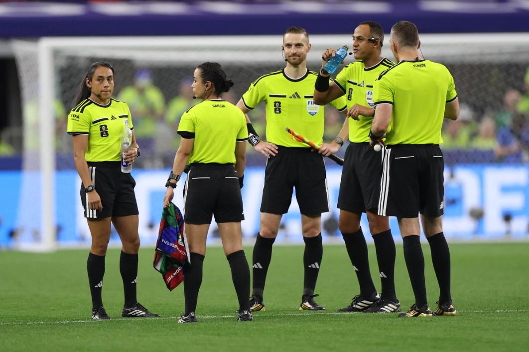 Referee Ismail Elfath and match officials during a hydration break in the match between Netherlands and Japan at Dallas Stadium on June 14, 2026 (Photo by Francois Nel/Getty Images)