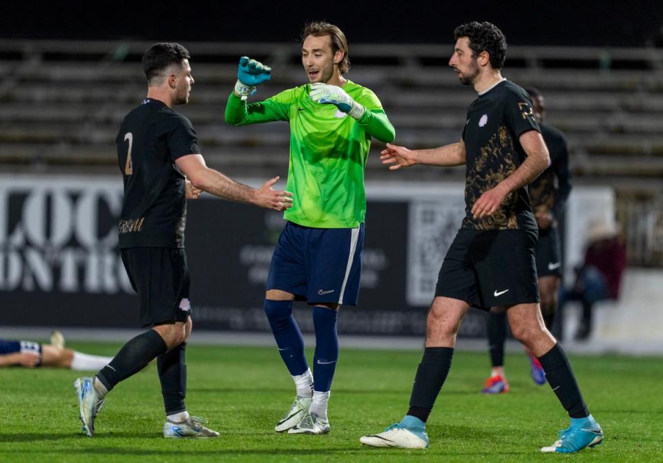 Virginia Dream players celebrate on the field during an Open Cup match