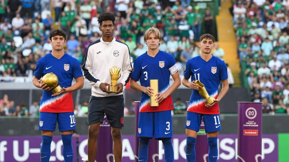 Niko Tsakiris, Nolan Norris and David Vazquez hold their Golden Ball, Fair Play Award and Golden Boot on the podium