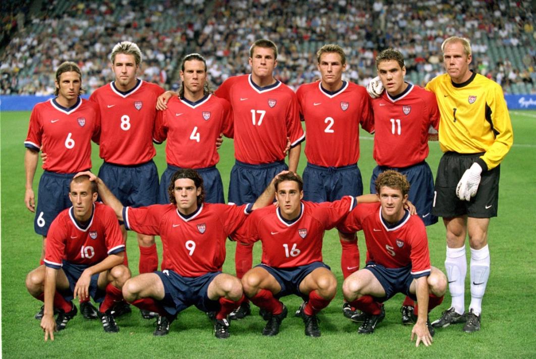 US Mens Starting 11 in red jerseys and blue shorts