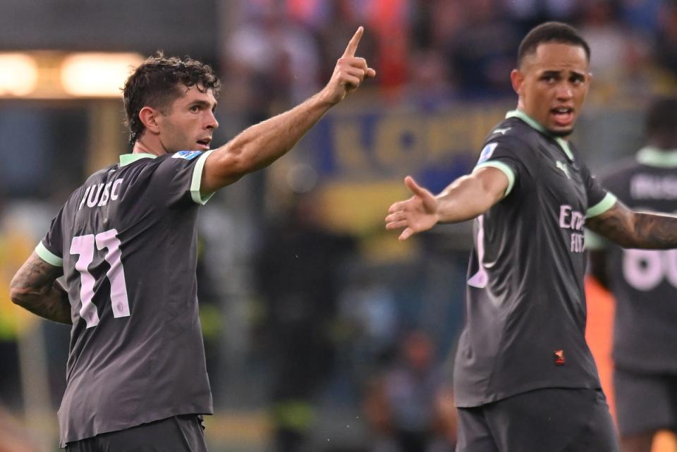 Christian Pulisic points his finger up in celebration for AC Milan