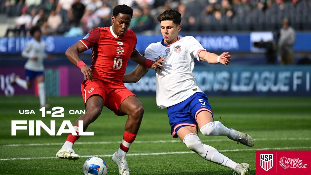 Max Arfsten for the USMNT contests a ball with a Canada player during a match