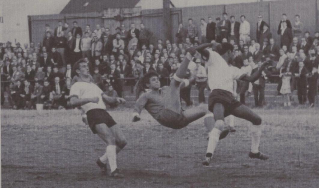 Werner Roth – a future U.S. Men’s National Team player who went on to star alongside Pele and Sylvester Stallone in the 1981 major motion picture ‘Victory’ – hits an overhead kick for the NY German-Hungarians on one of those ancient Sundays out on the Metropolitan Oval. Look close and you can see the iron rail that used to ring the field at the famous old ground. 