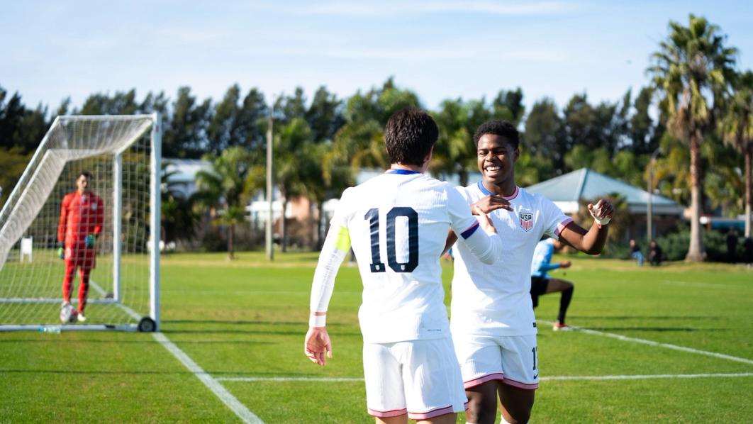 U.S. Under-19 MYNT players celebrate a goal in white kits