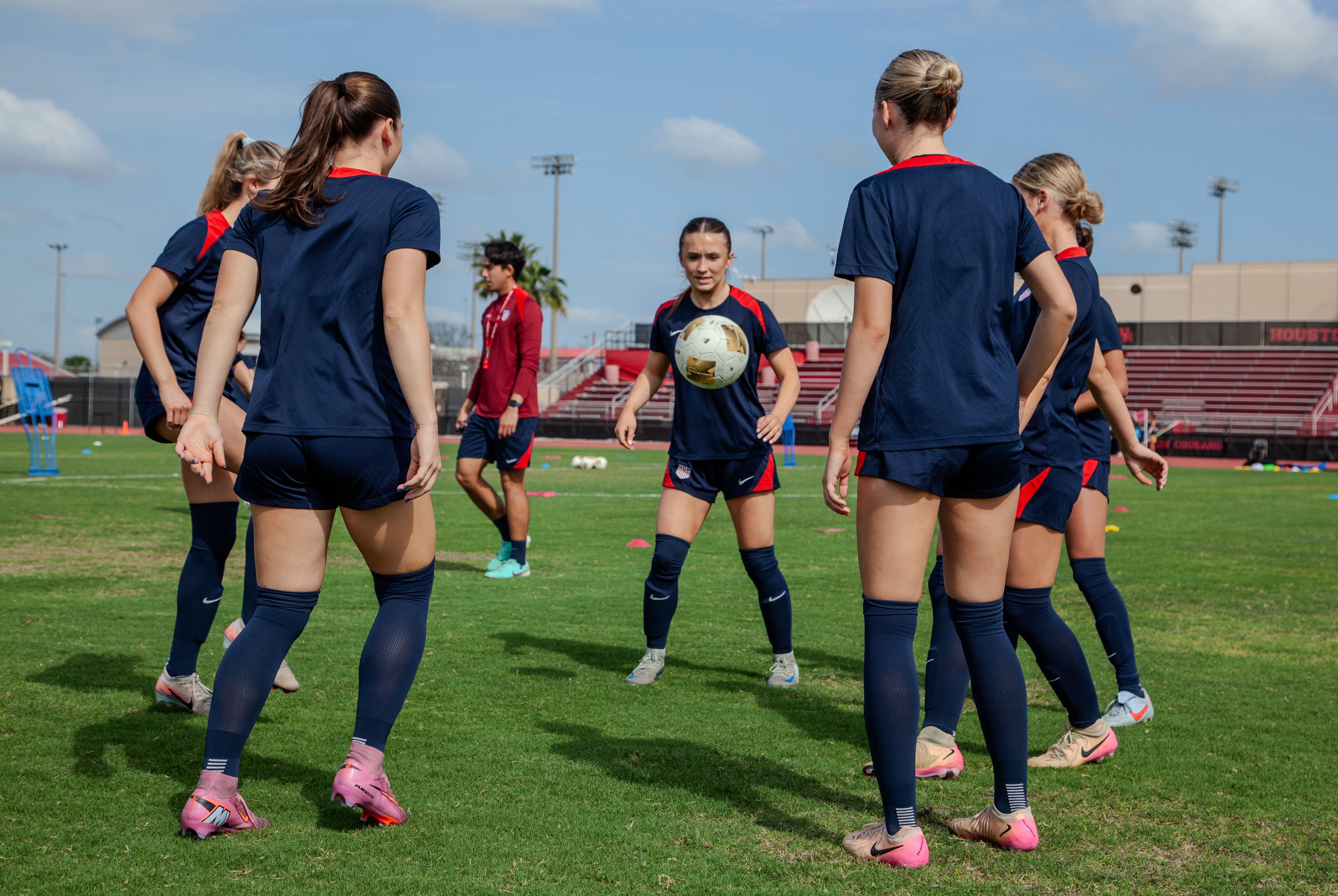 Professional soccer players taking part in a soccer training drill.