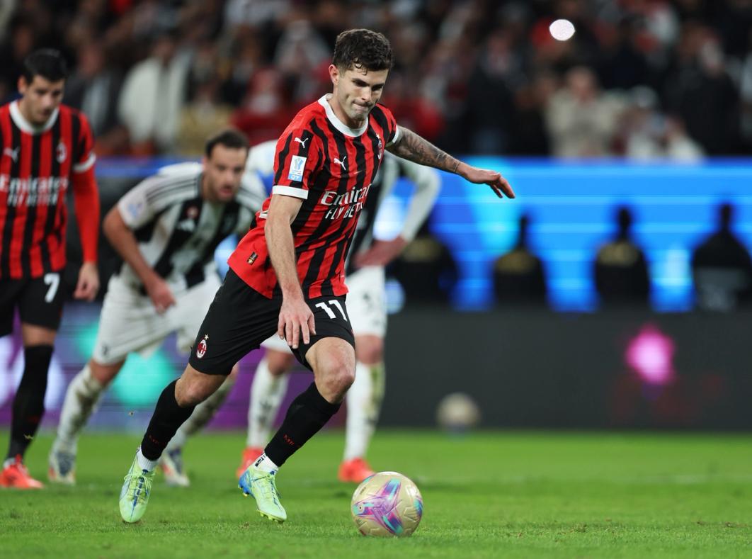 Christian Pulisic takes a penalty kick for AC Milan