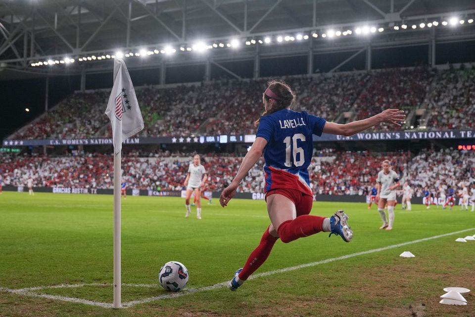 Rose Lavelle takes a corner kick during a match against Iceland