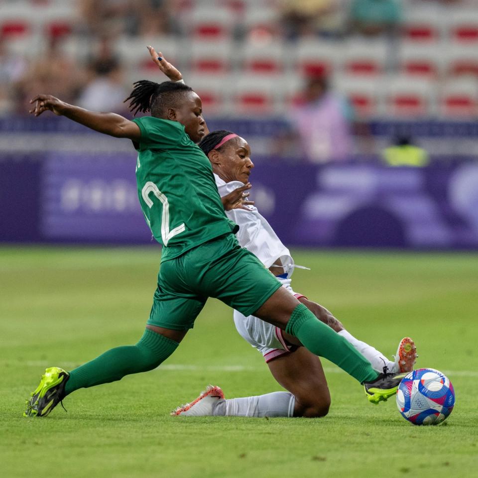 Crystal Dunn defending