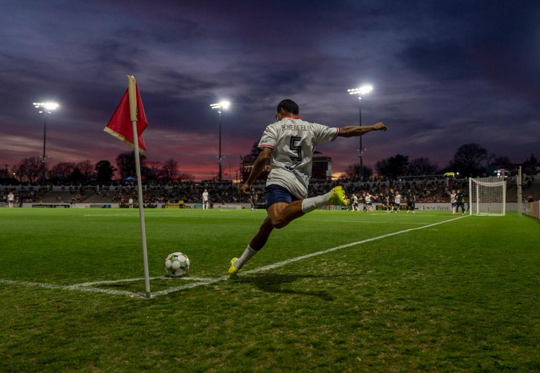 A Virginia Dream player takes a corner kick during a match