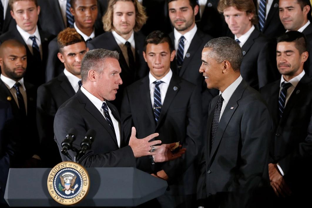 Vermes with President Barack Obama at the White House in suits with players in the background
