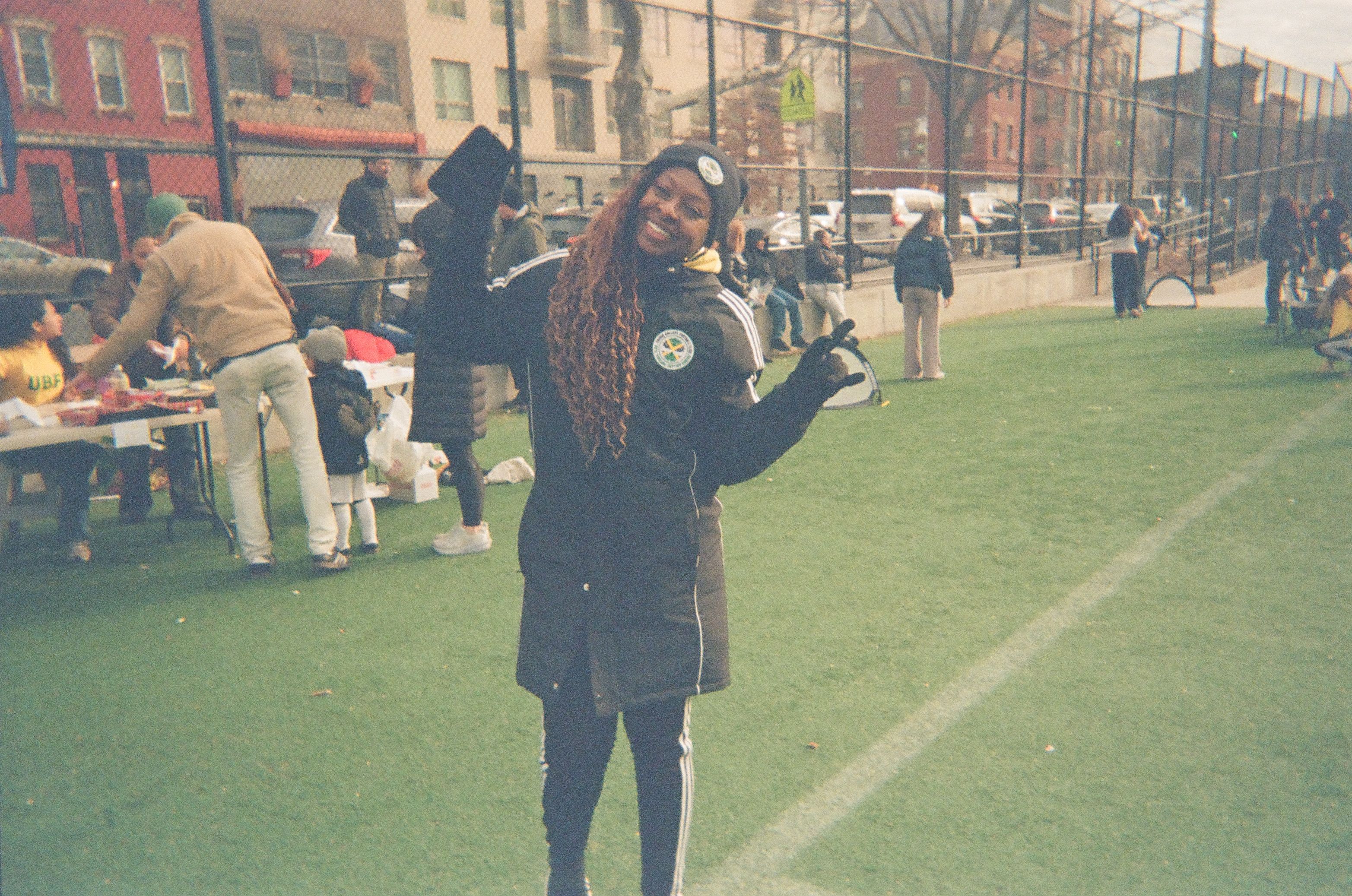 A coach posing for a photo.