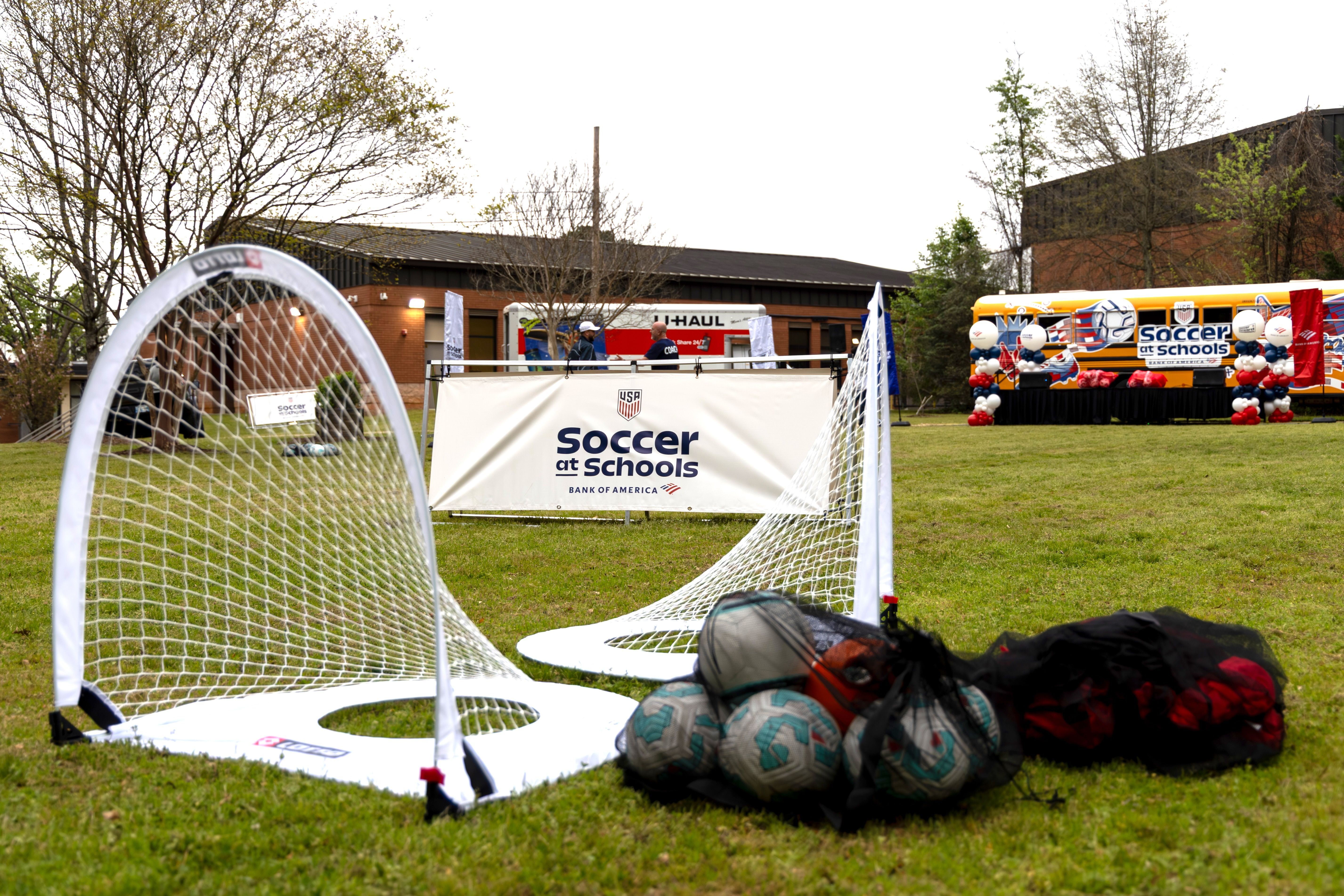 Soccer goals and equipment set up outdoors for a Soccer at Schools event.
