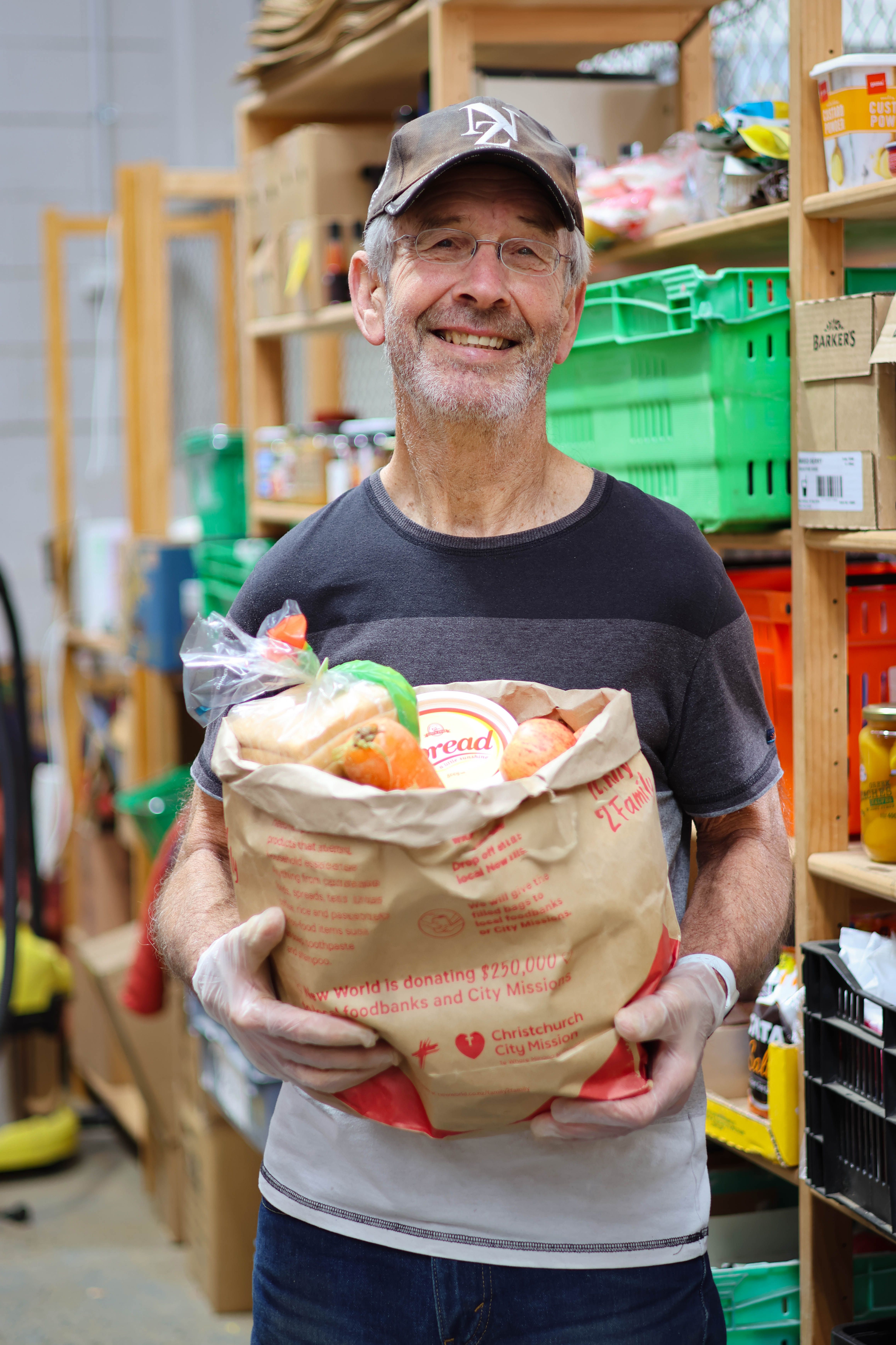 a man holds a box of food