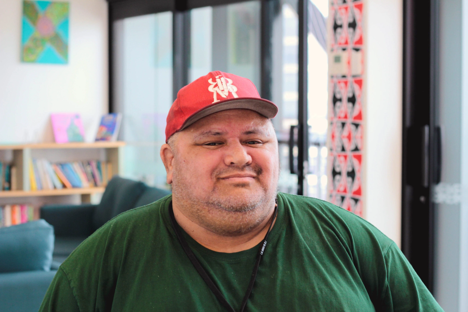 a man wearing a red hat that says ny on it