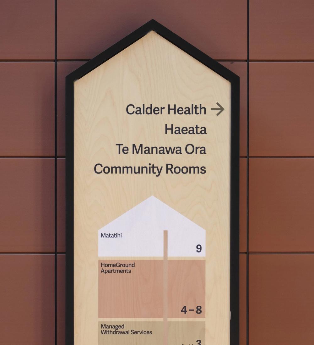 a busy highway at night with a building in the background .