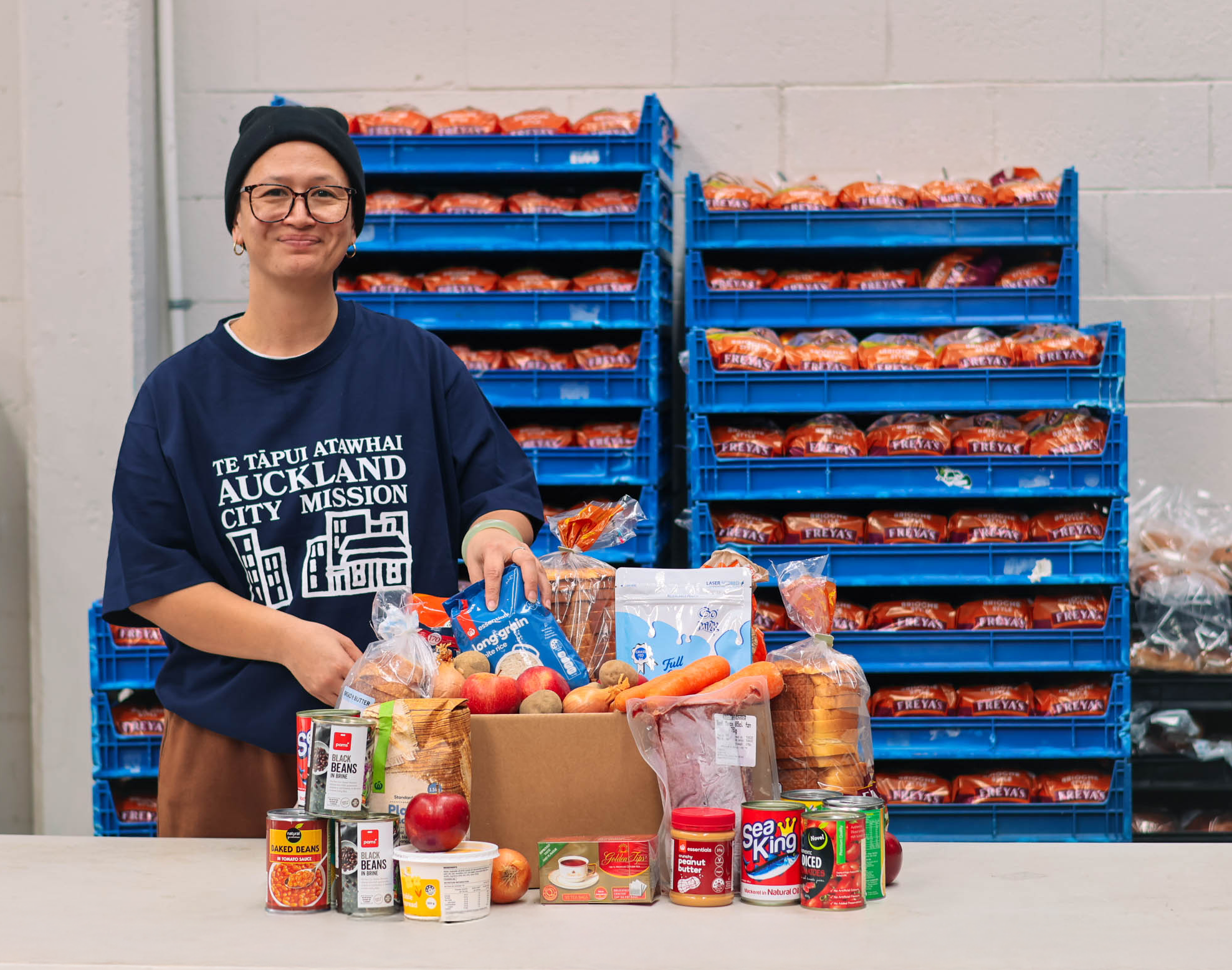 a man wearing a shirt that says auckland city mission