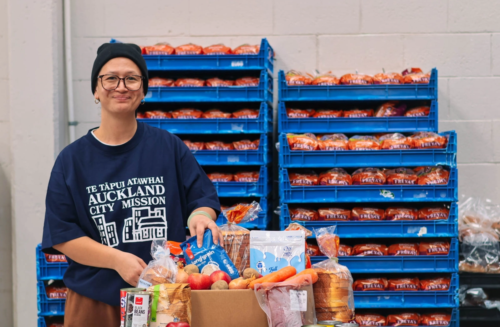 a man wearing a shirt that says auckland city mission