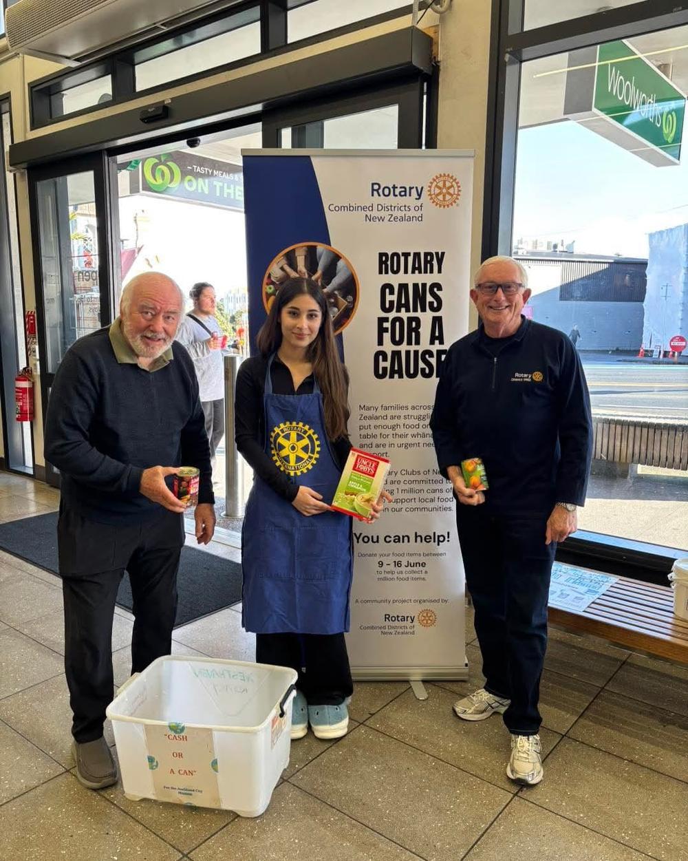 a man and a woman are standing next to each other on a sidewalk .