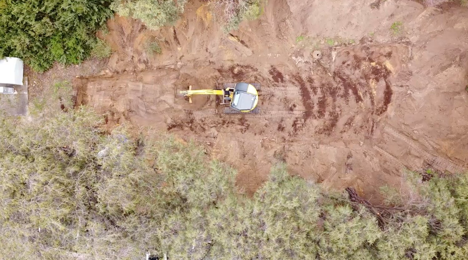 an excavator digging in the dirt