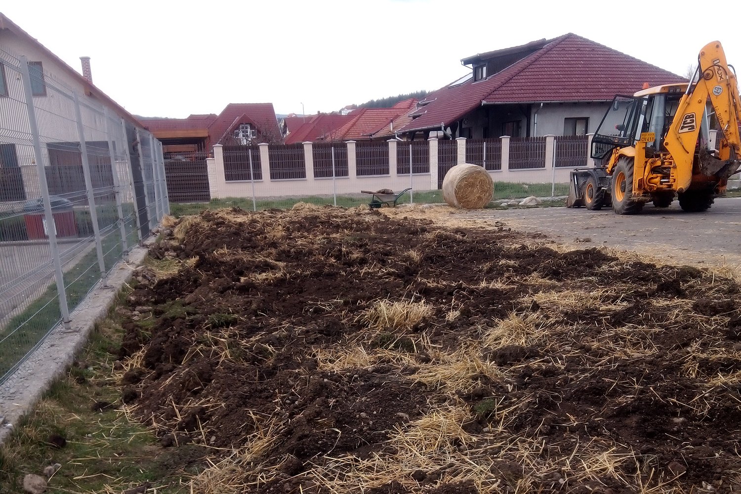 a dirt field and tractor
