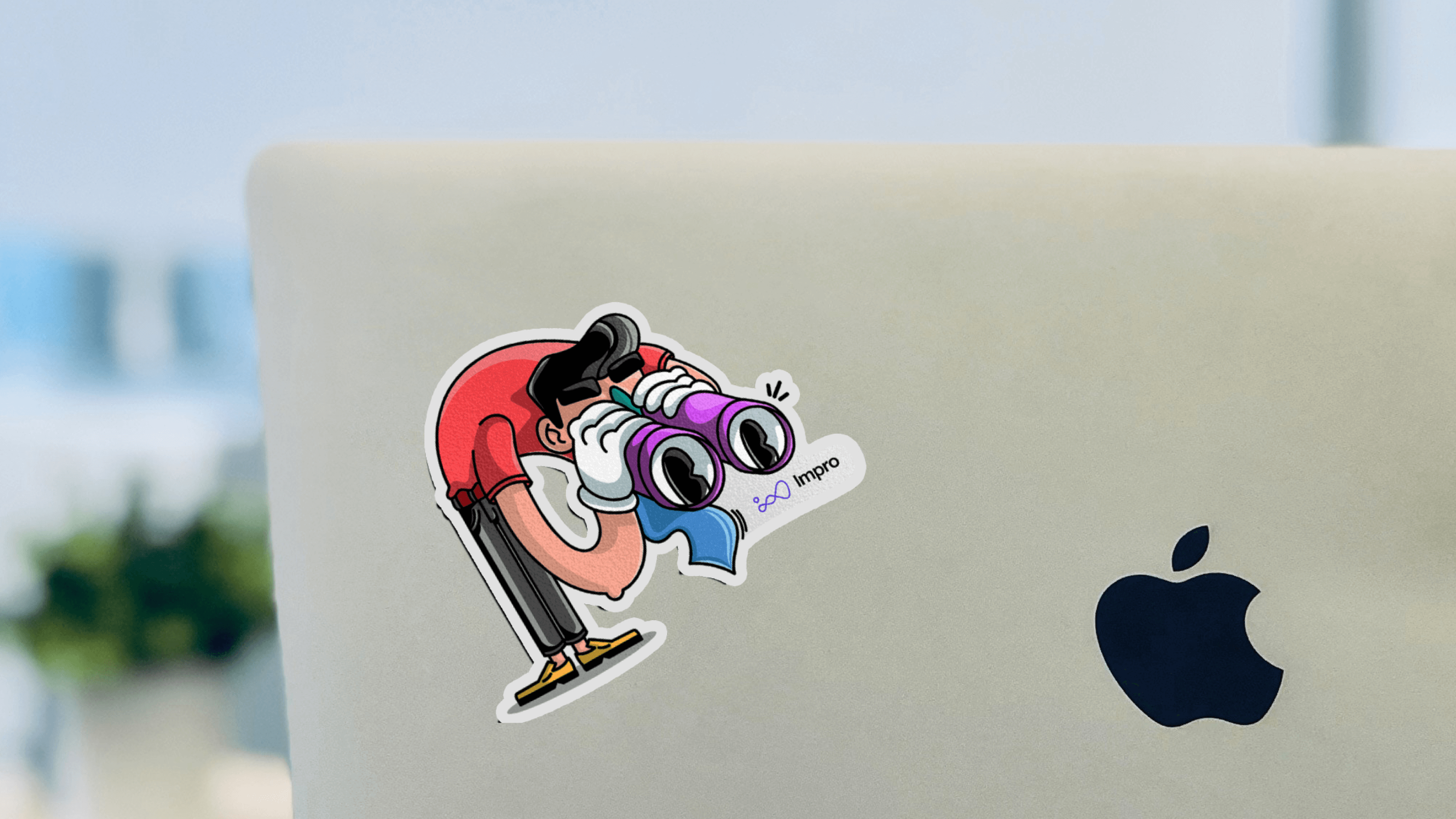 A sticker with a branded illustration in the Impro style on a laptop.