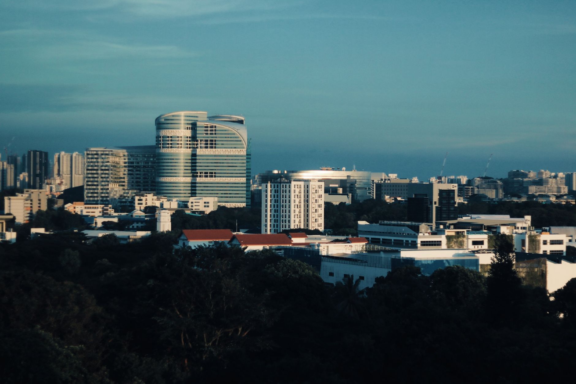 Modern skyscrapers in Singapore's business district under a clear sky, representing Brocent's Global Headquarters and its role as an ASEAN and APAC IT support hub