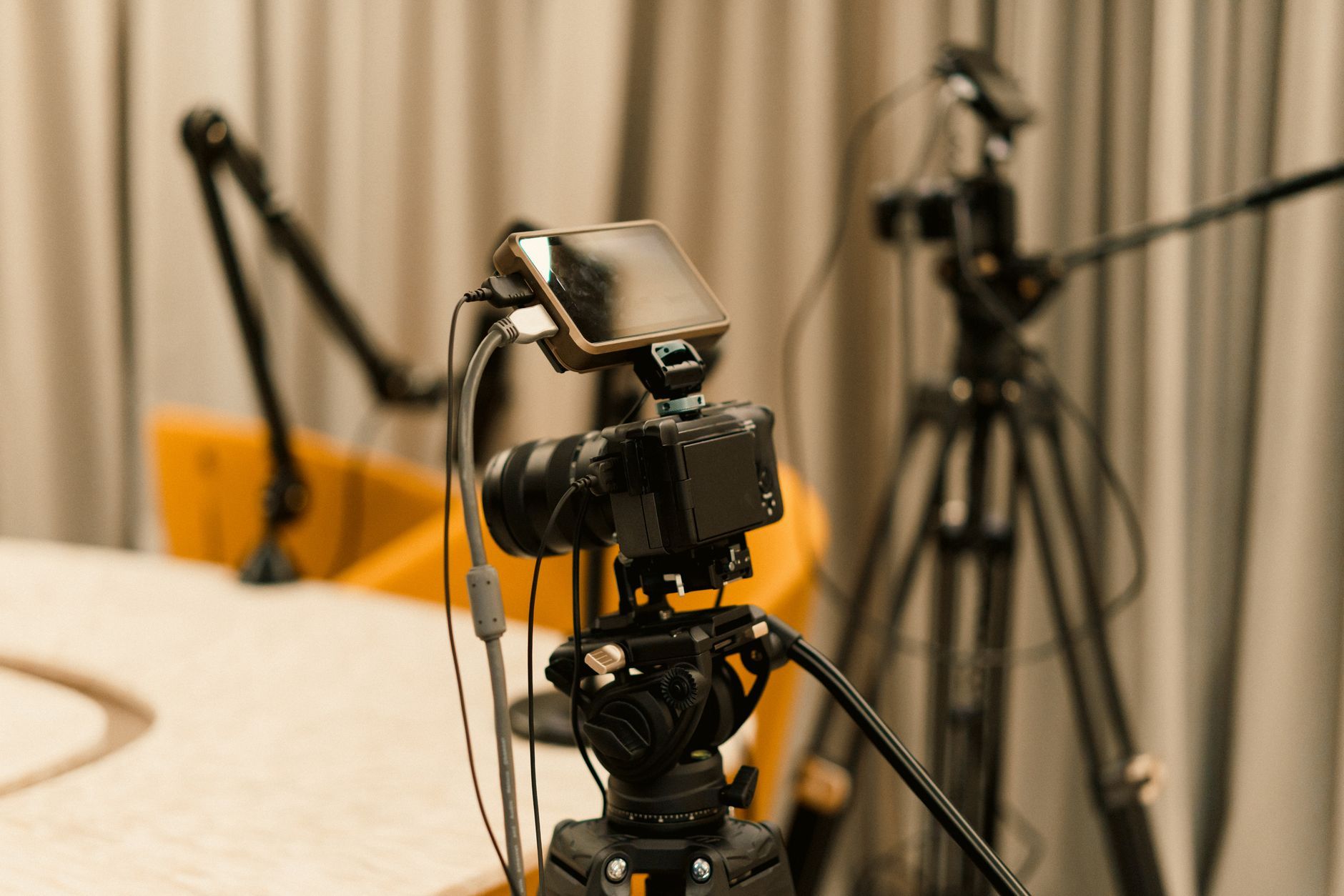 A professional studio set up with cameras, microphones and lighting ready for a live broadcast, representing the livestream operation an e-commerce team in Hangzhou runs during a campaign window