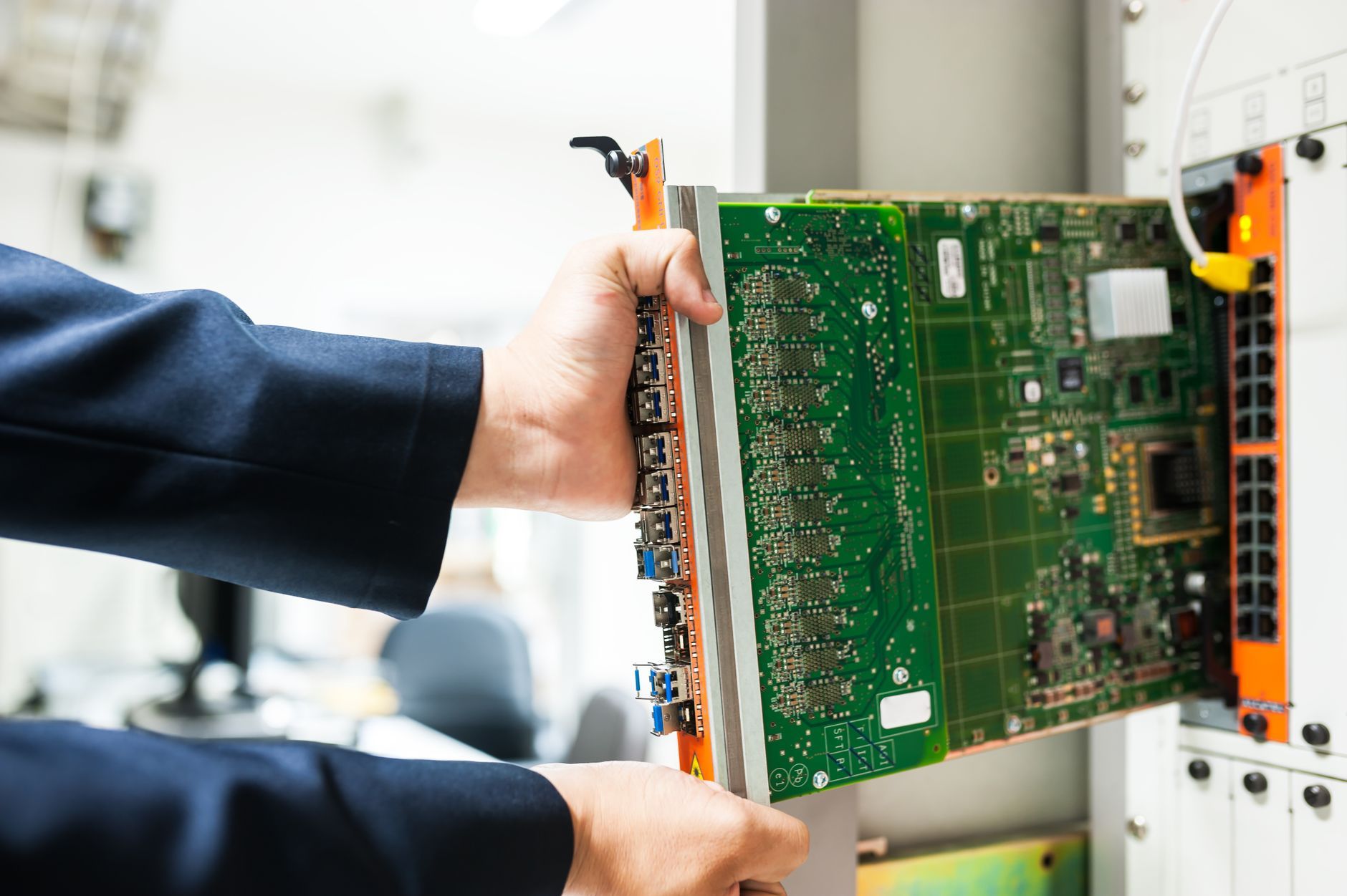 Field engineer installing a network gateway device in a retail store during a nationwide rollout