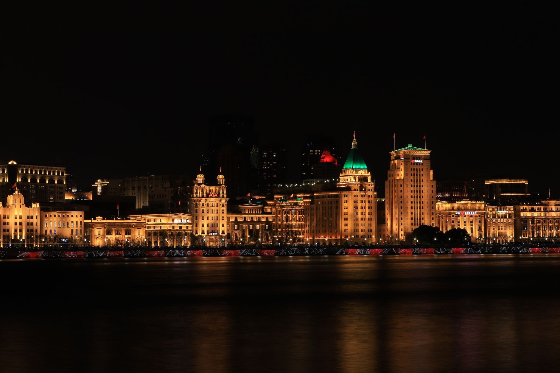 Shanghai's illuminated waterfront at night, representing the China entity of a foreign vendor operating across the mainland